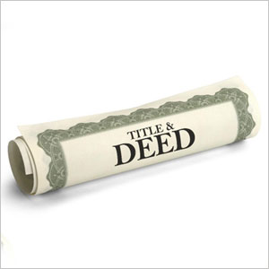 A rolled paper with words "title and deed"