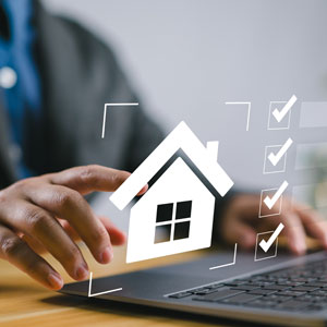 Hands on laptop with house and checklist icons, resolving real estate disputes and property conflicts.